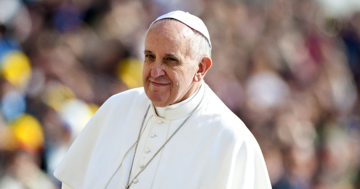 Pope Francis in focus with crowd in background