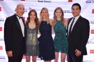 Five people in front of a National Gay & Lesbian Task Force step-and-repeat backdrop.