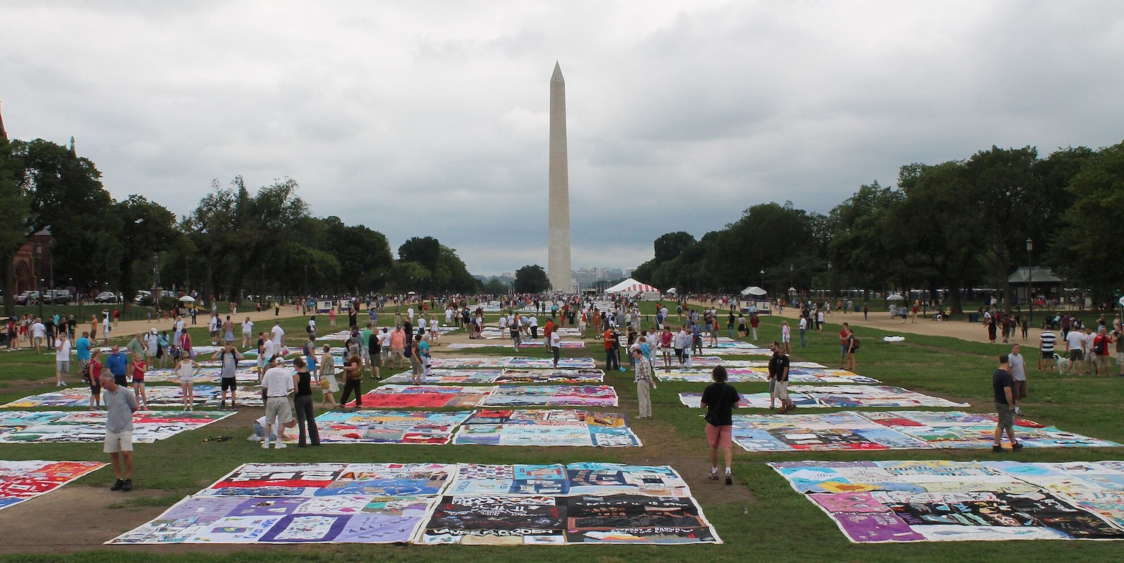 Panels of the NAMES Project AIDS Memorial Quilt spread across the National Mall