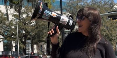 Female Activist in Florida with Bullhorn