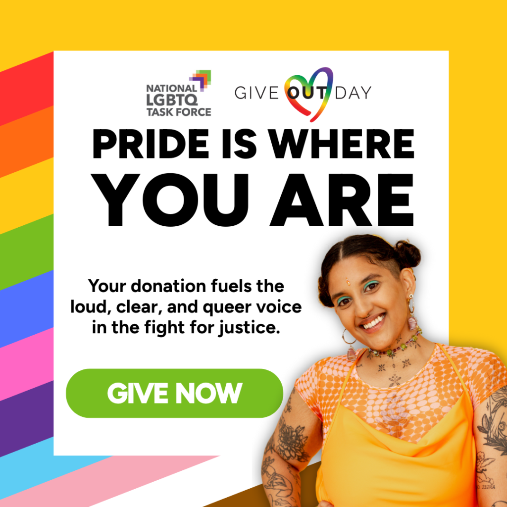 Woman smiles at the camera in front of a rainbow background for PRIDE Give Out Day. 