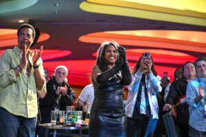 People standing and clapping